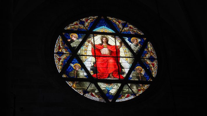 A stained glass window of Jesus