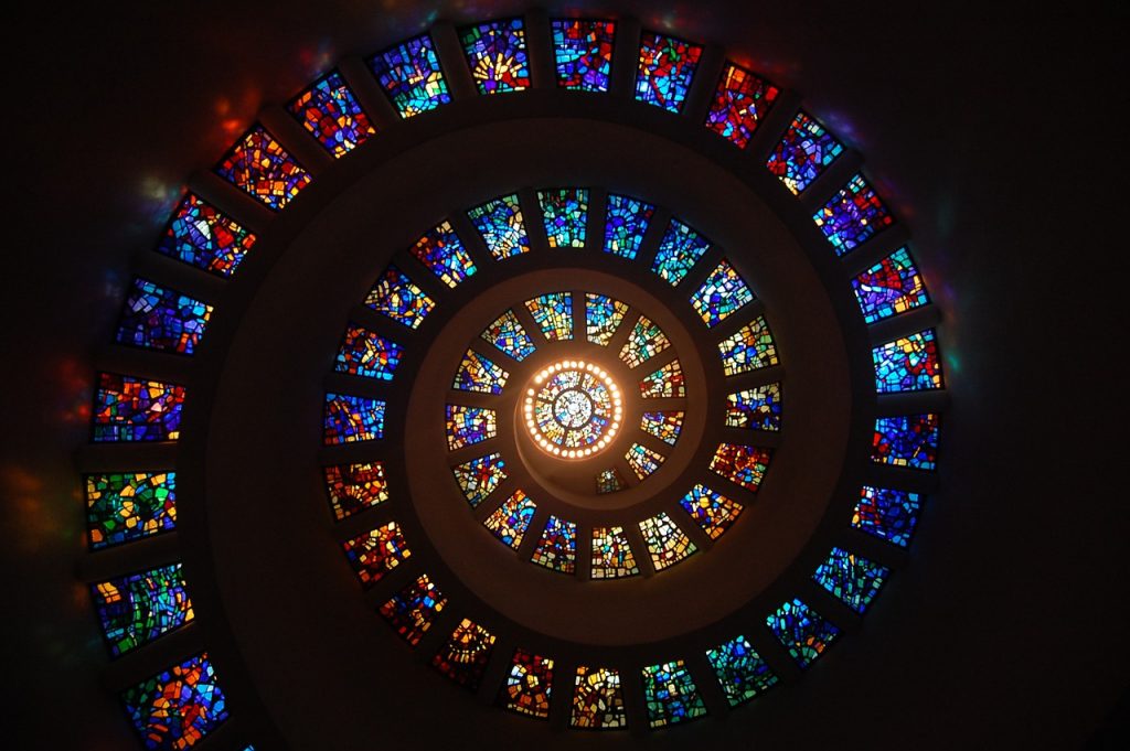 a wall of spiral stained glass windows