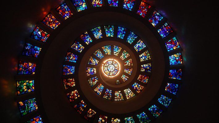 a wall of spiral stained glass windows